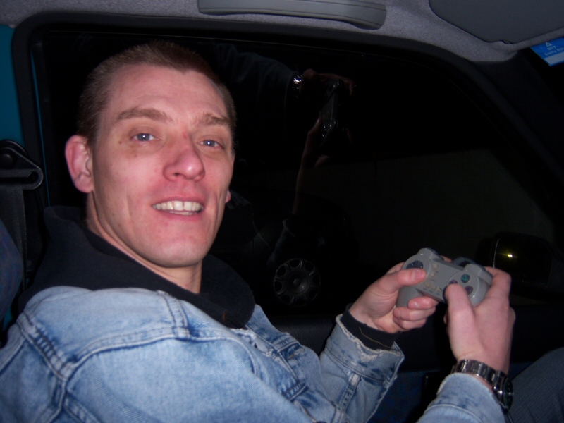Photo - Husband Dave sat in the car passing the time on a portable Playstation - Grand Theatre Slides 2008 - Blackpool Illuminations Gallery - &copy; Sarah Myerscough