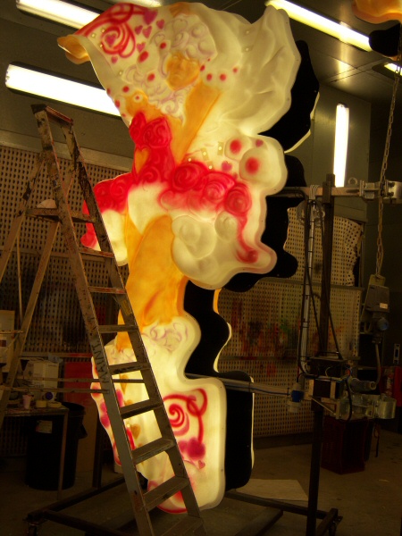 Photo - Cupide very early on with light shades of red and pink added - Painting - Making of a Blackpool Illumination - &copy; Sarah Myerscough