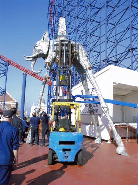 Photo - Third leg being attached during erection next to the Big One - Dali Style Elephant - Blackpool Pleasure Beach Gallery - &copy; Sarah Myerscough