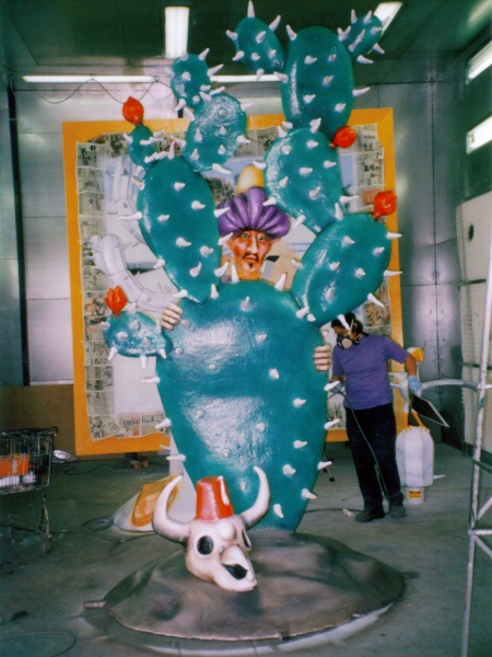 Photo - Finished painted cactus and thief with fellow artist Shoichi working on his cactus in the background - Ali Baba 2005 - Blackpool Illuminations Gallery - © Sarah Myerscough
