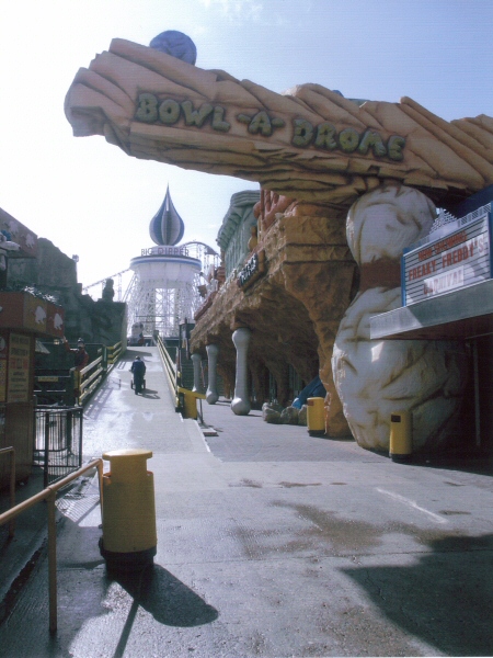 Photo - Different view of the Flintstone style ediface with the iconic Big Dipper ride in the distance - Various Repair and Repaint Jobs - Blackpool Pleasure Beach Gallery - © Sarah Myerscough