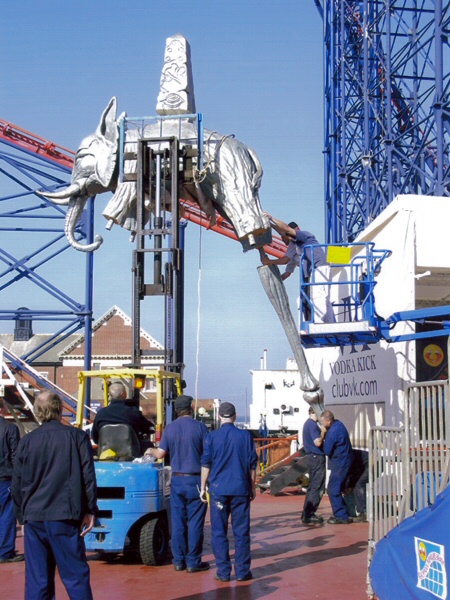 Photo - First leg being attached during erection. Many hands make light work? - Dali Style Elephant - blackpool pleasure beach gallery - © Sarah Myerscough